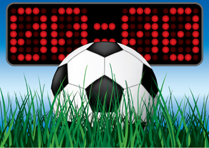 This image shows a soccer ball with a timeclock or scoreboard in the background. The time and score are at zero.